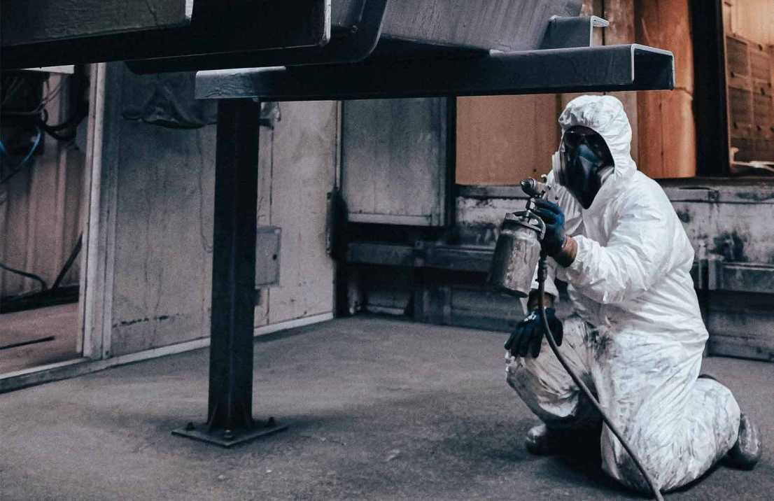 Strata pest control in Sydney professional inspecting apartment complex for pests and applying safe treatment solutions